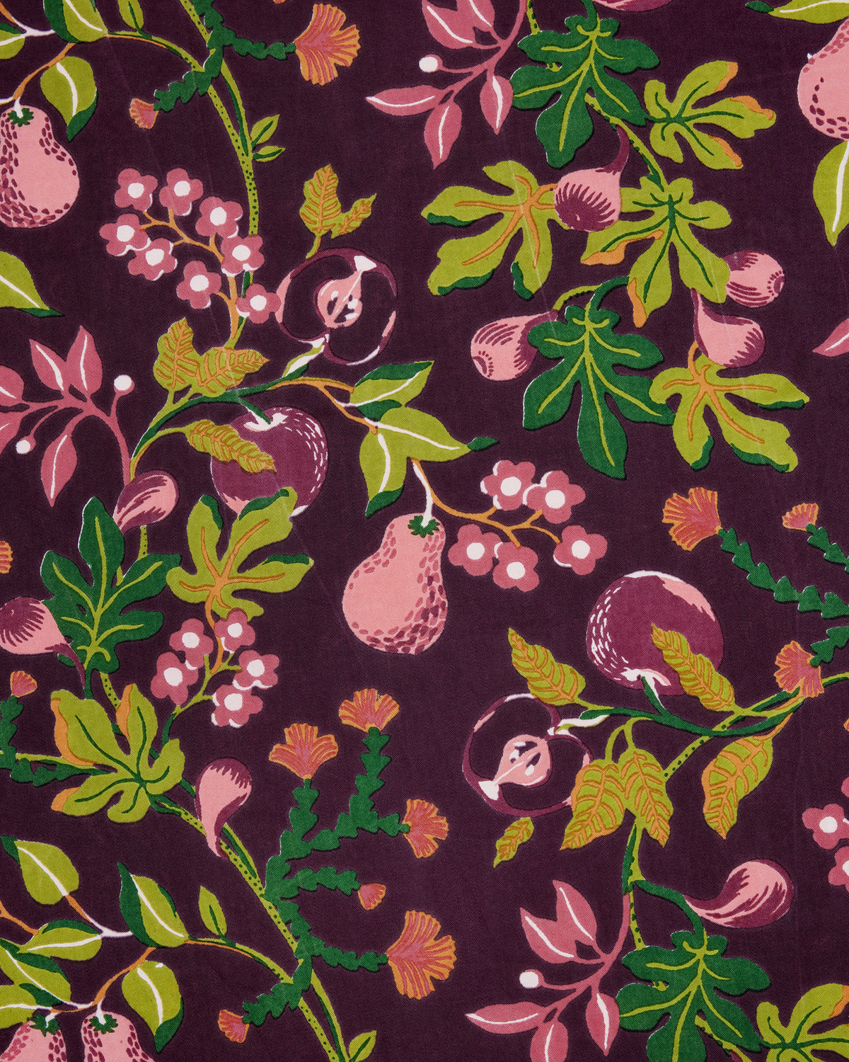 Close-up of a plum-colored print with pink pears, berries, leaves, and flowers.