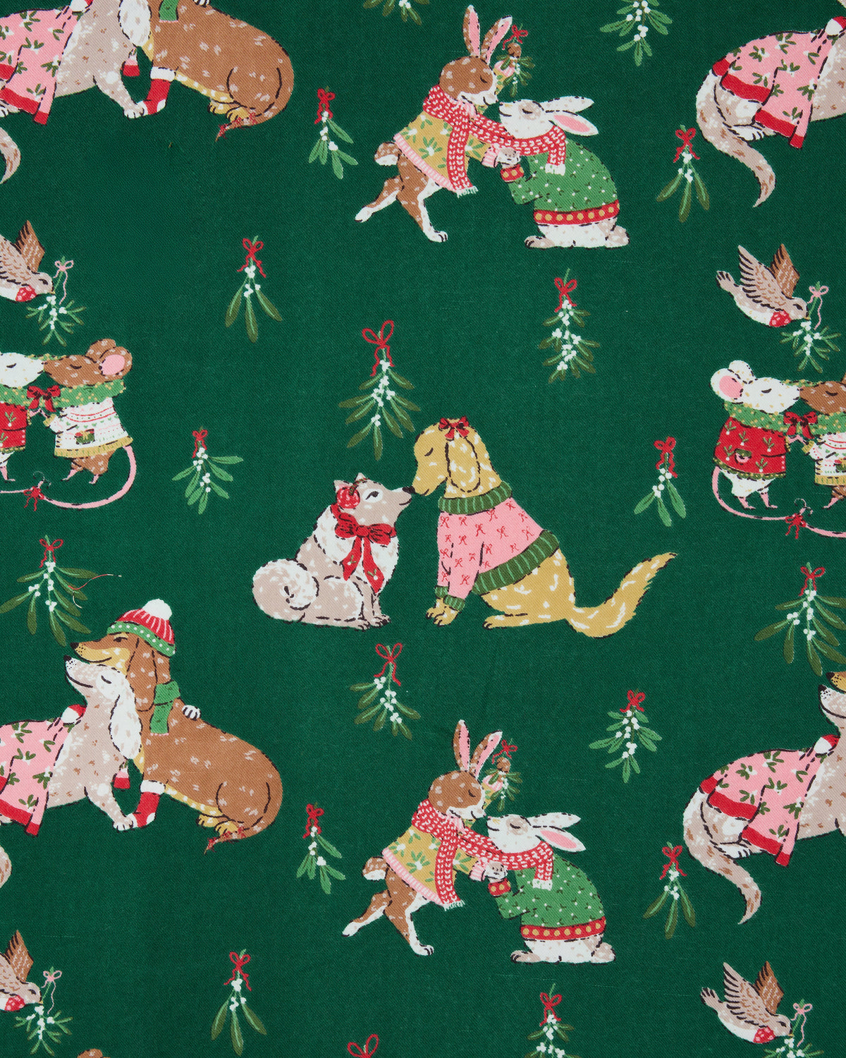 Close-up of the green Mistletoe Kiss print featuring illustrated dogs, cats, rabbits, birds, and mistletoe sprigs.
