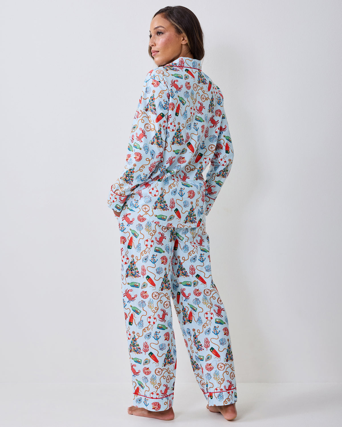 Back view of the Holidays Ahoy petite long pajama set with a light blue nautical holiday print.