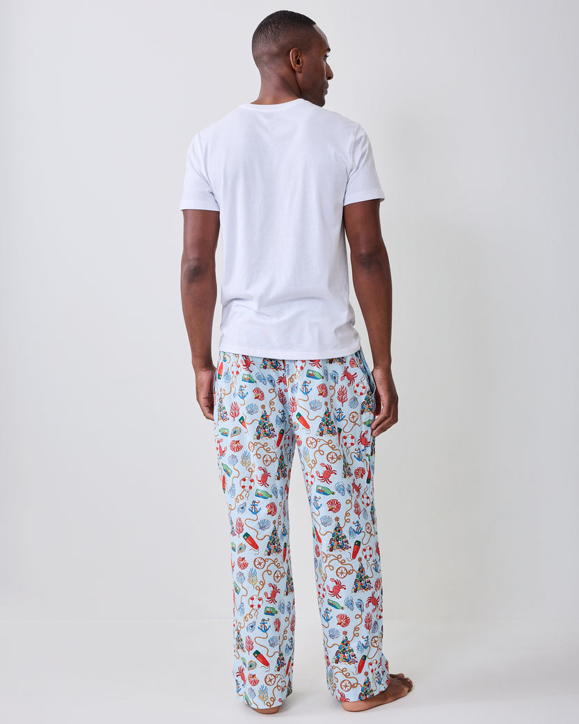 Back view of the men's long pajama pants with a light blue nautical holiday print.