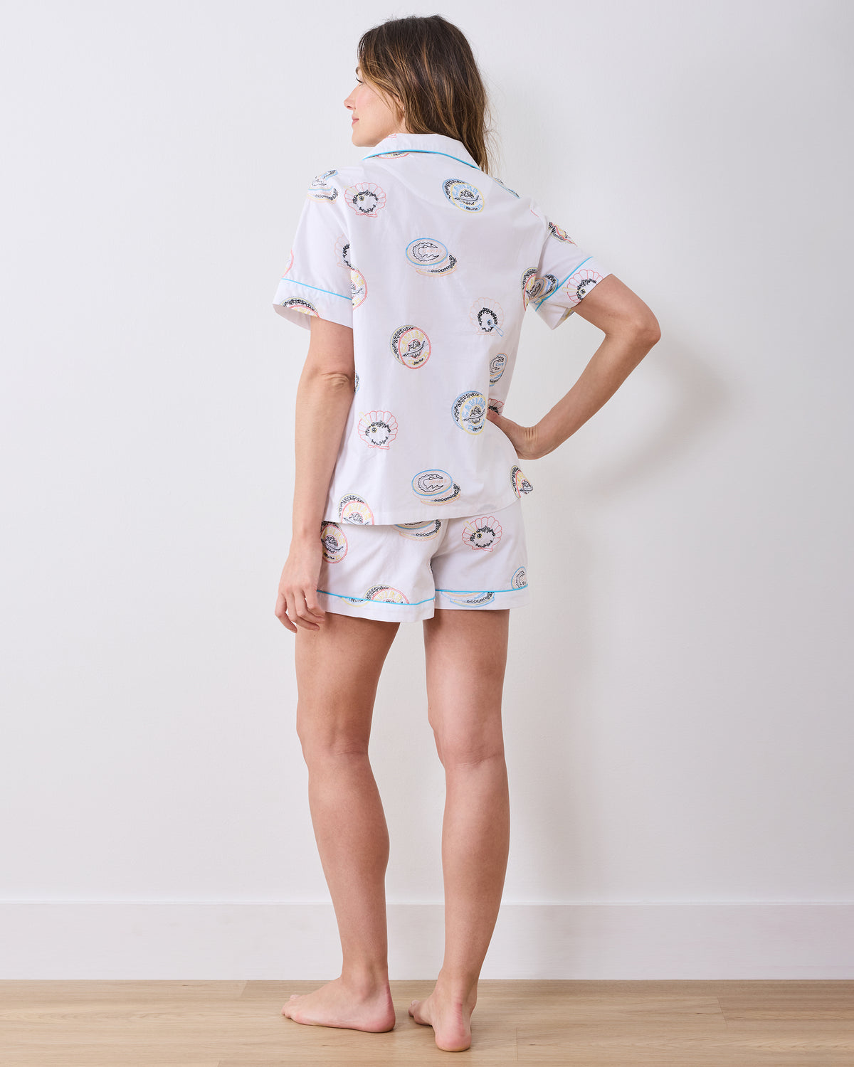 Back view of the pearl embroidered short pajama set with a short-sleeve button-down top and matching shorts.