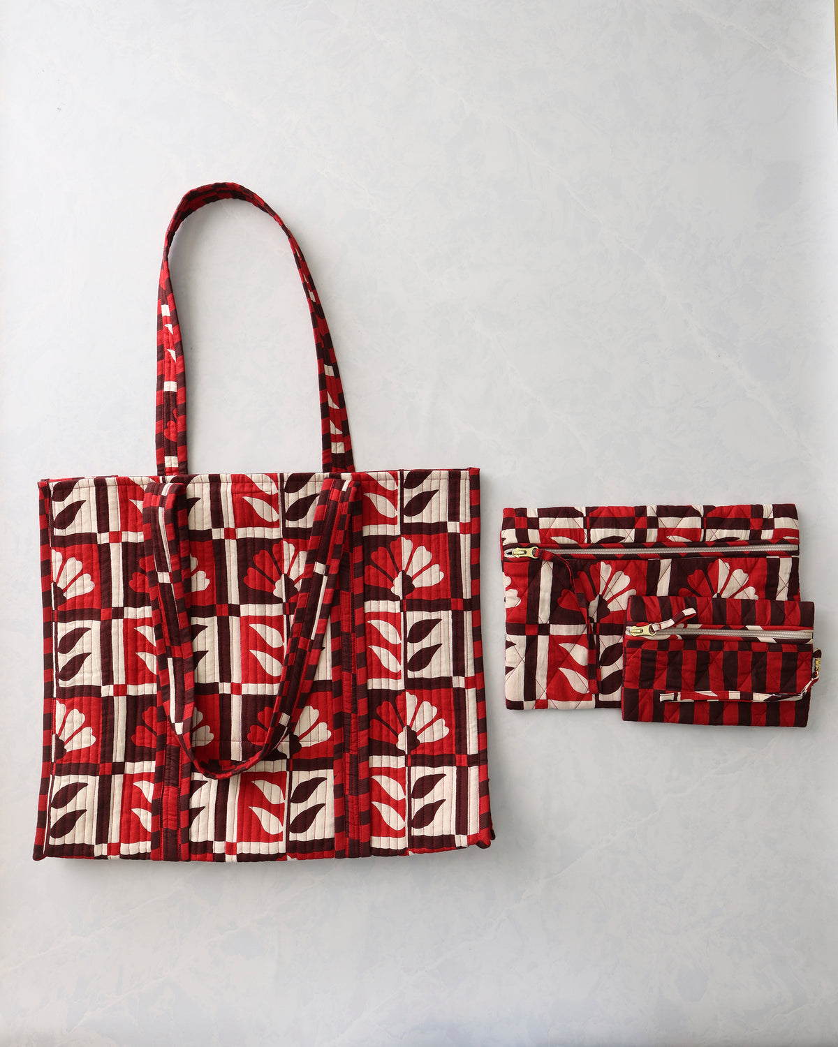 Bordeaux patterned tote with two matching zip pouches from the Traveler Tote and Go Anywhere Pouch set.