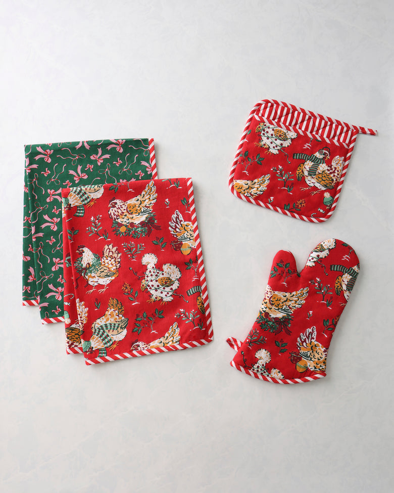 Holiday Hens kitchen bundle with two red patterned tea towels, one green patterned tea towel, an oven mitt, and a pot holder