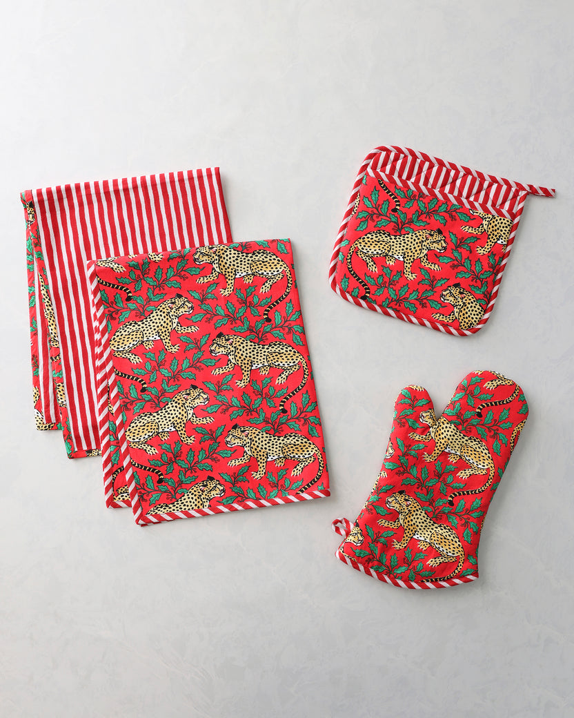 Kitchen bundle with two leopard-print tea towels, a pot holder, and an oven mitt.
