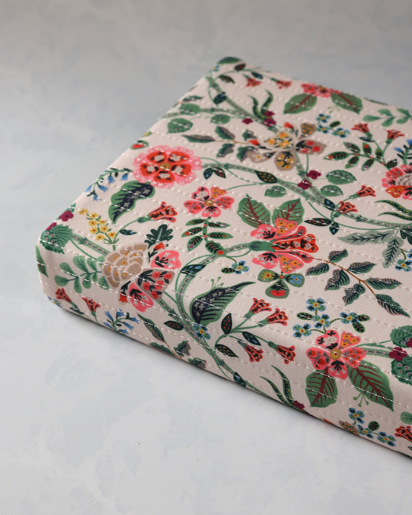 Close angled view of the Gracie journal showing its quilted floral cover and rounded corners.