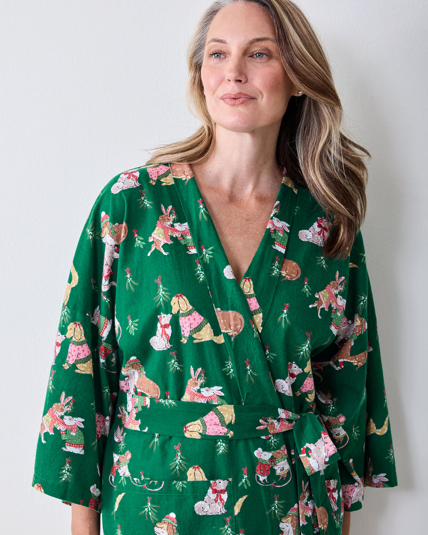 Front view of the green Mistletoe Kiss flannel long robe with a holiday critter print, wrap front, matching belt, and three-quarter sleeves.