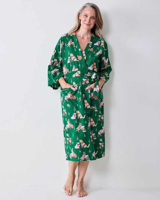 Full front view of a person wearing the green Mistletoe Kiss flannel long robe with a holiday critter print, matching belt, and pockets.