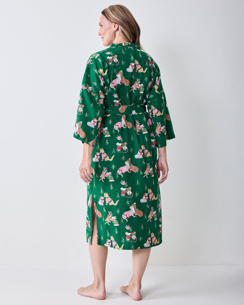 Back view of the green Mistletoe Kiss flannel long robe showing the holiday critter print, waist belt, and side slit.