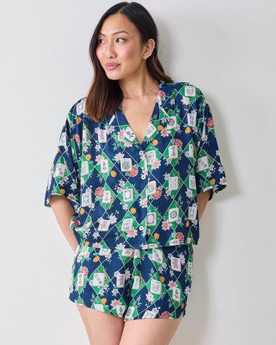 Full-length front view of the Mahj Garden Eco Satin Sweet Dreams Set in Wintergreen, with a short-sleeved top and matching shorts in a floral mahjong-tile print.