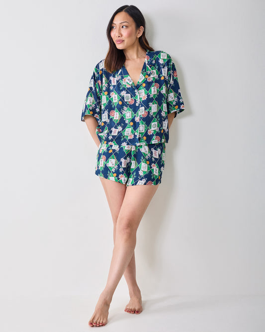 Full-length front view of the Mahj Garden Eco Satin Sweet Dreams Set in Wintergreen, with a short-sleeved top and matching shorts in a floral mahjong-tile print.