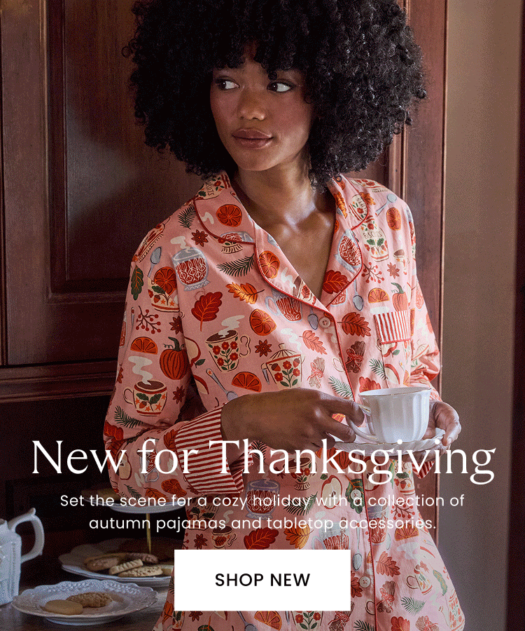 Promotional banner showing a person in pink holiday-print pajamas holding a cup, with text about new Thanksgiving pajamas and tabletop accessories and a SHOP NEW button.