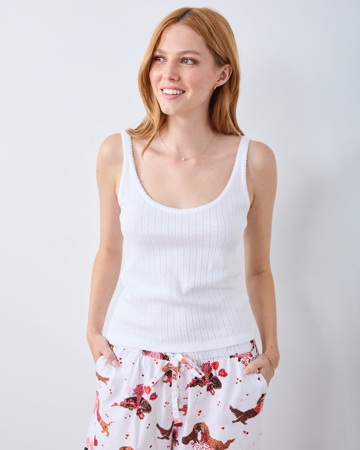Front view of the white Esme tank top with a scoop neckline, wide straps, and vertical pointelle detailing.