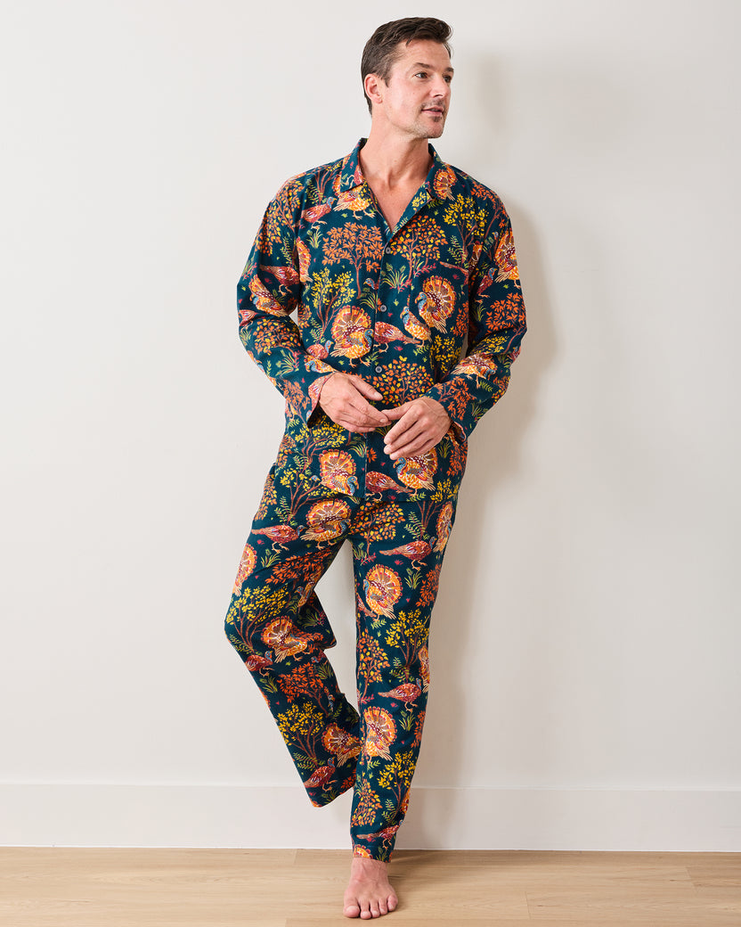 Front three-quarter view of the Turkey Trot navy long pajama set with a button-front shirt and matching turkey-and-floral print pants.