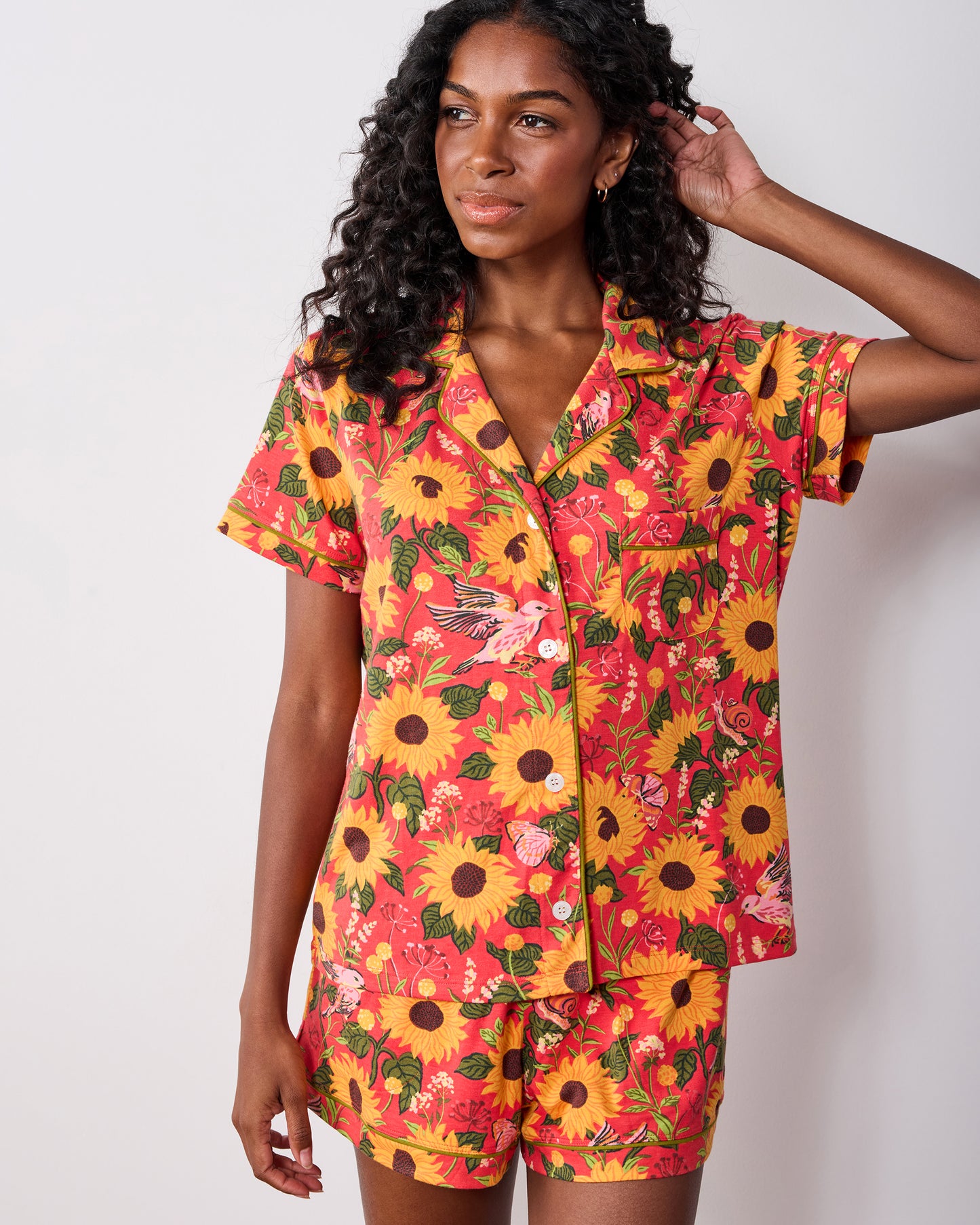 Front view of the orange Autumn Sunflowers short pajama set with a collared button-front shirt and matching shorts.