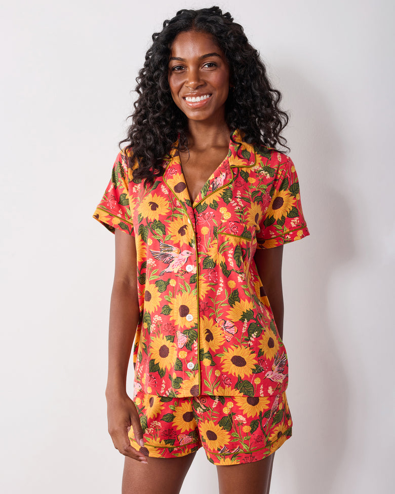 Close front view of the orange Autumn Sunflowers pajama top and matching shorts.