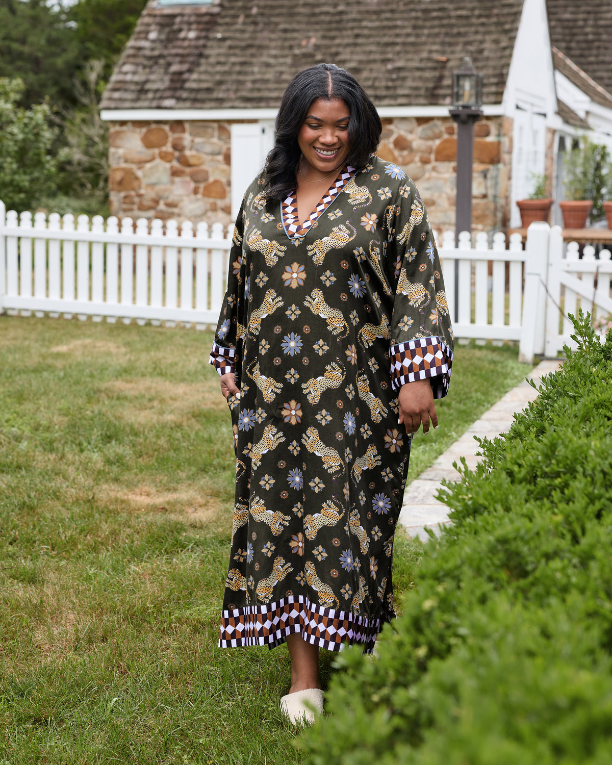 Front view of the Bagheera Kaleidoscope Kennedy caftan with leopard and floral print, patterned neckline, cuffs, and hem.