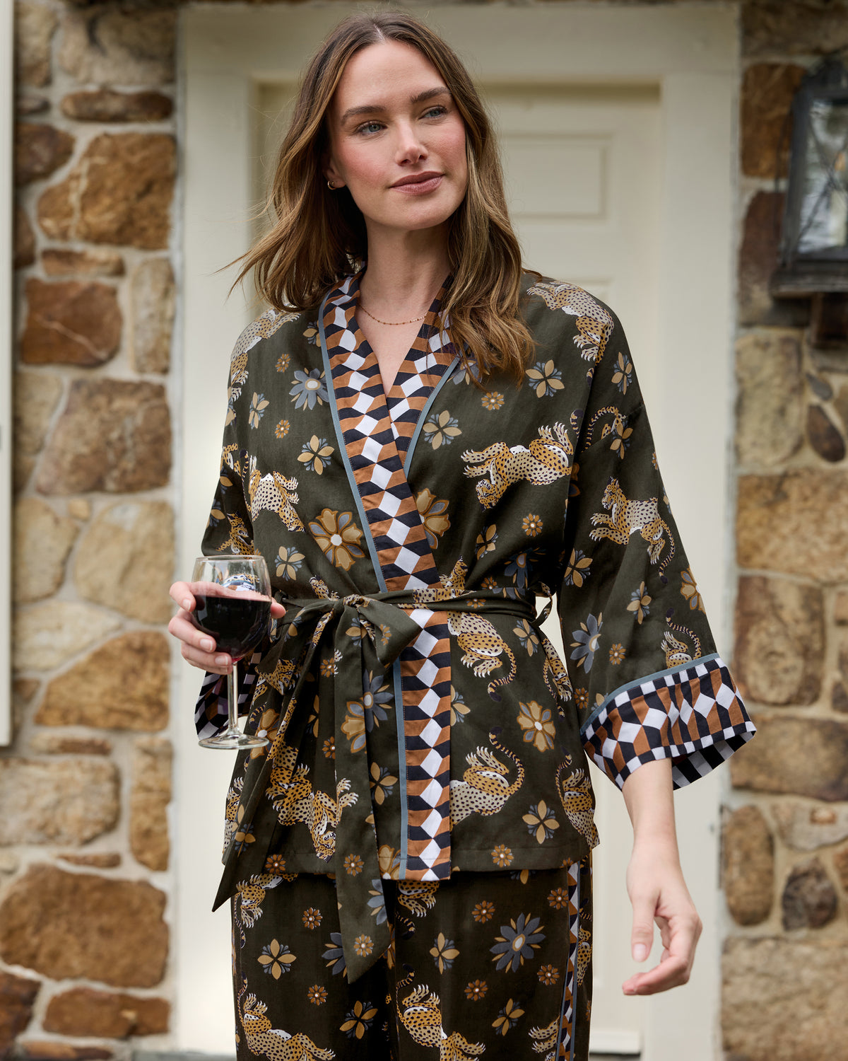 Olive wrap pajama set with a belted top, wide-leg pants, and leopard-and-flower print.