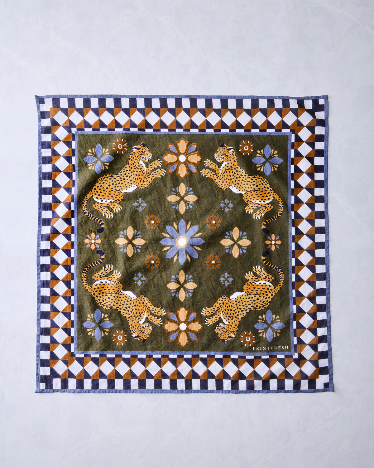 Square olive Bagheera Kaleidoscope bandana scarf laid flat with four leopard figures, flowers, and a geometric border