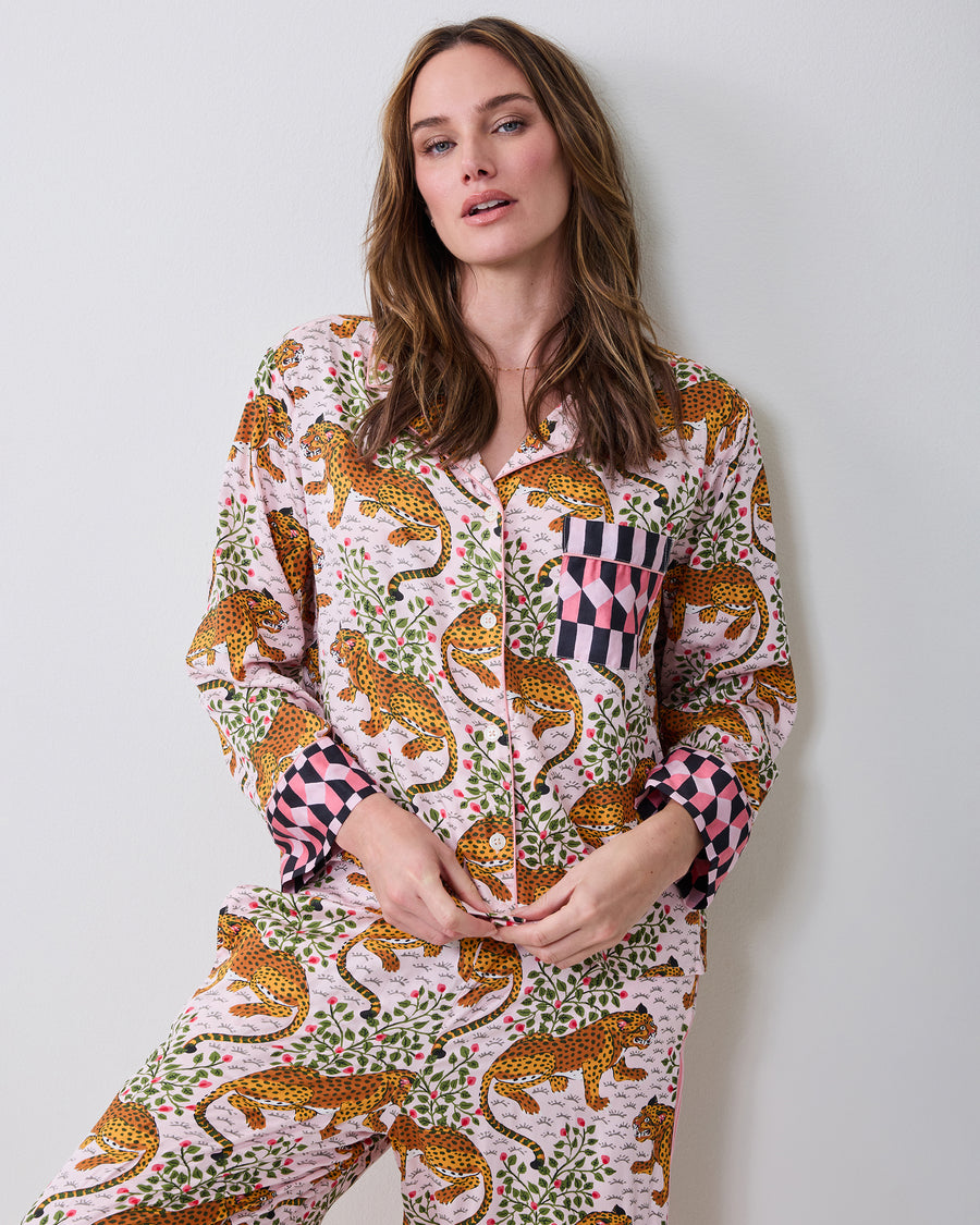 Front view of the blush Bagheera pajama set with leopard-and-vine print, button-front top, chest pocket, and contrasting cuffs.