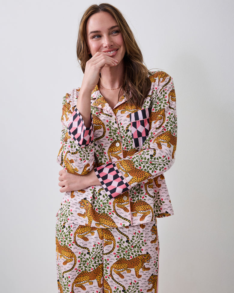Three-quarter front view of the blush Bagheera pajama set with leopard-and-vine print, chest pocket, and contrasting geometric cuffs.