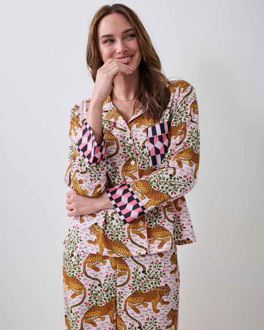 Three-quarter front view of the blush Bagheera pajama set with leopard-and-vine print, chest pocket, and contrasting geometric cuffs.