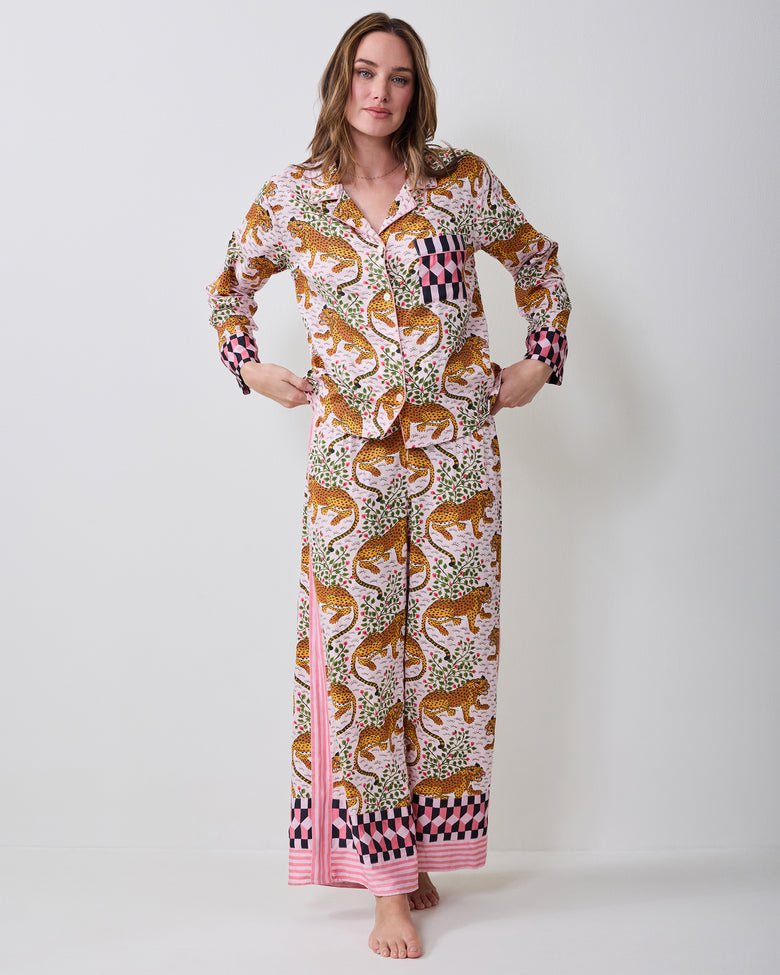 Front view of the Bagheera blush pajama set on a model, showing the collared button-front top, chest pocket, and wide-leg pants.