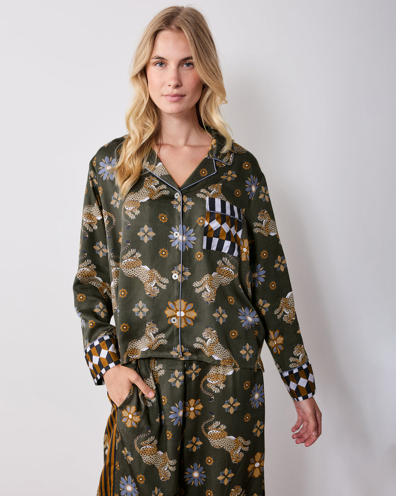 Front view of the olive petite Rittenhouse pajama set, showing the collared button-front shirt, chest pocket, wide-leg pants, leopard and flower print, and checkerboard cuffs.