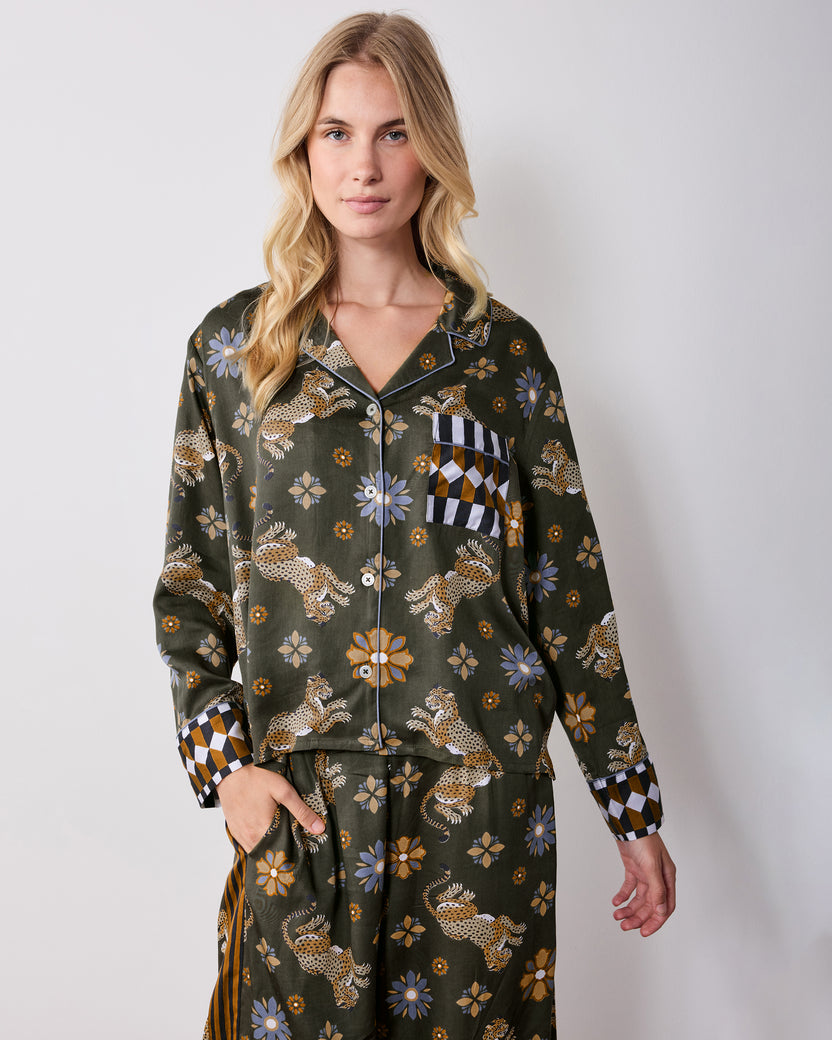 Front view of the olive petite Rittenhouse pajama set, showing the collared button-front shirt, chest pocket, wide-leg pants, leopard and flower print, and checkerboard cuffs.
