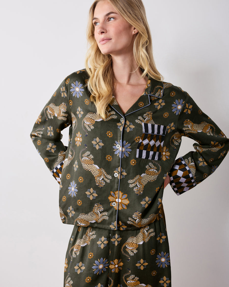 Front view of the olive Bagheera Kaleidoscope Rittenhouse set, showing a long-sleeved button-front top with geometric-trimmed cuffs and pocket, paired with matching printed pants.