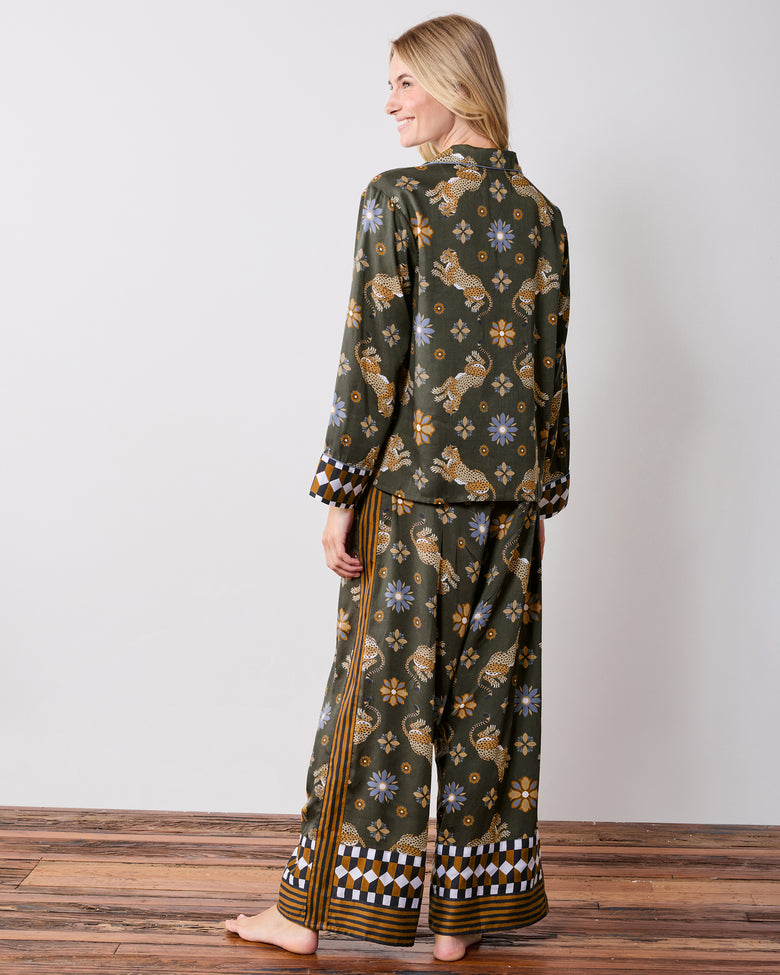 Back view of the olive Rittenhouse pajama set with a leopard and flower print, checkerboard cuffs, and striped pant hems.