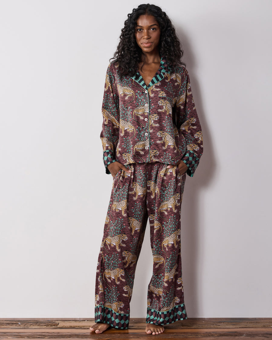 Full-length front view of a person wearing the raisin Bagheera leopard-print pajama set with a button-front top and wide-leg pants.