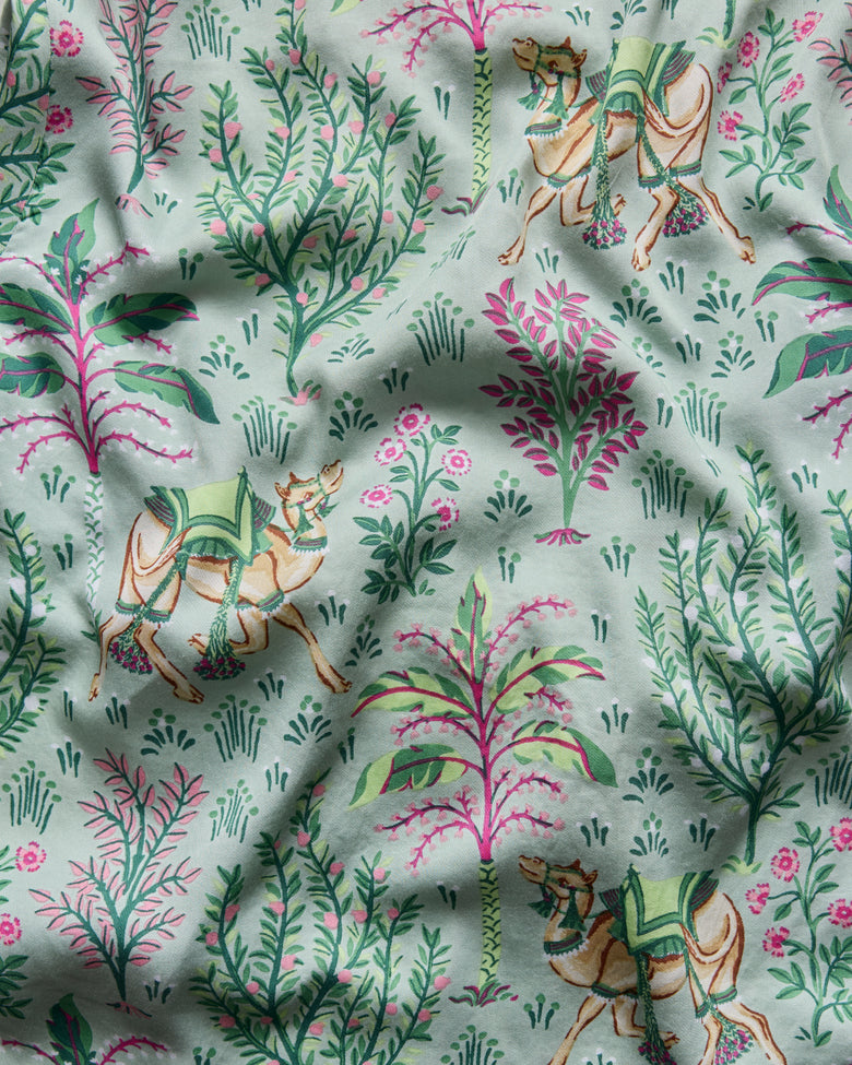 Avocado camel-and-desert-botanical pattern swatch for the Camel's Courtyard Eco Satin Rittenhouse Set.