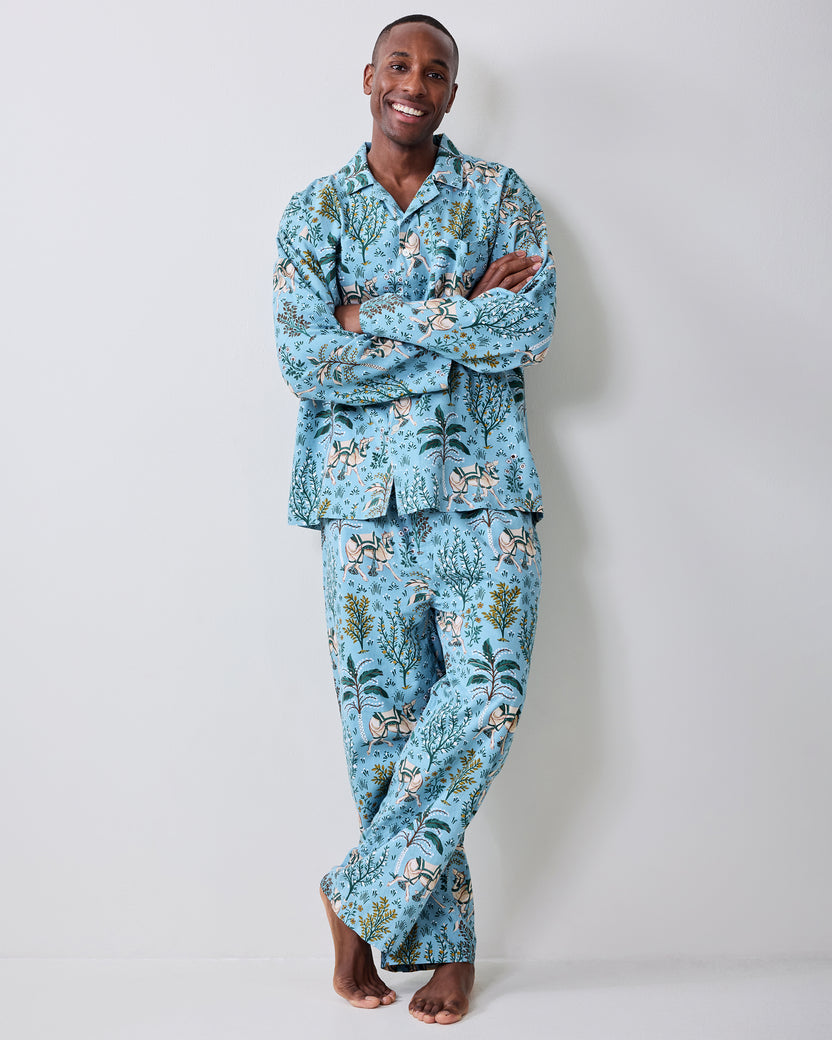 Front view of a model wearing the Slate Blue Camel's Courtyard long pajama set with camel and botanical print.