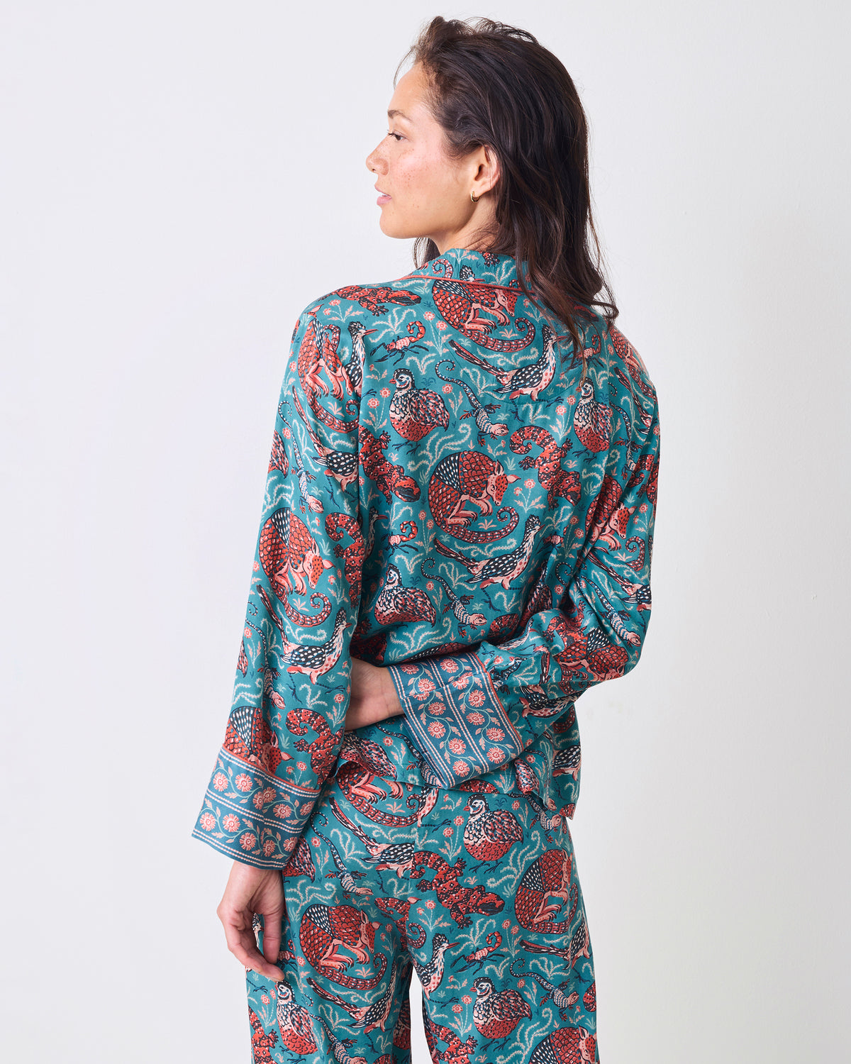 Back view of the teal Canyon Critters Petite Eco Satin Soho Set with a long-sleeve top and wide-leg pants.