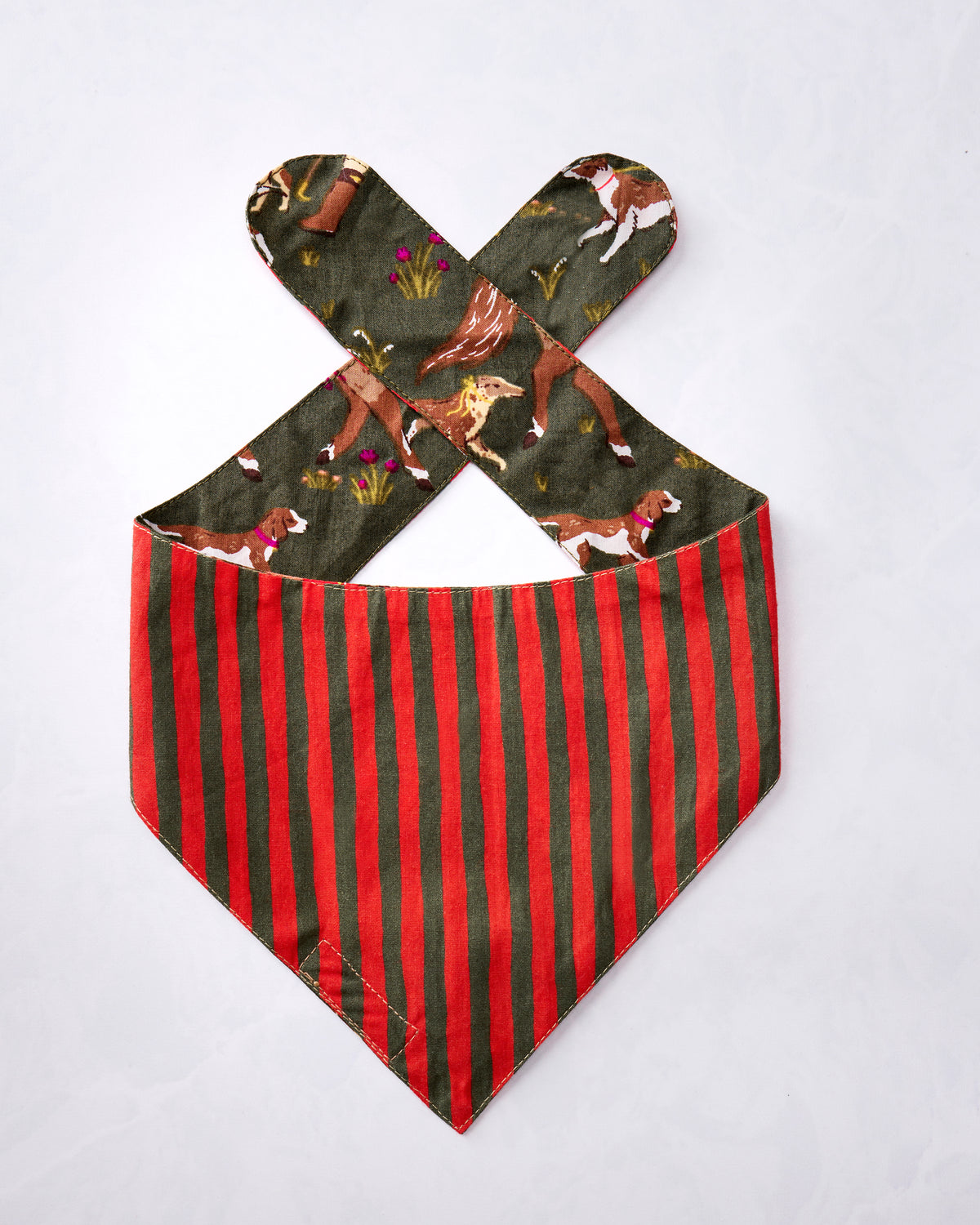 Reverse side of the Pine Grove pet bandana laid flat with contrasting vertical stripes and printed tie straps.