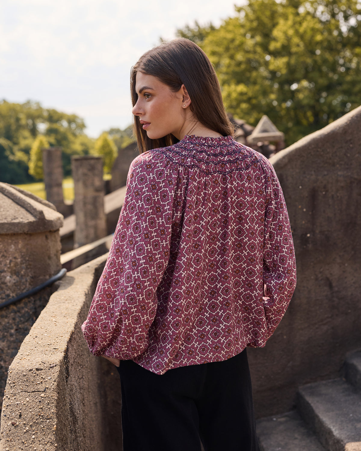 Back and side view of the patterned long-sleeve Aspen blouse.