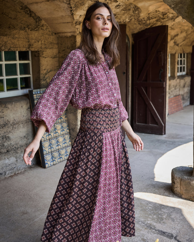 Front view of the patterned Coraline skirt with contrasting panels and a gathered waistband.