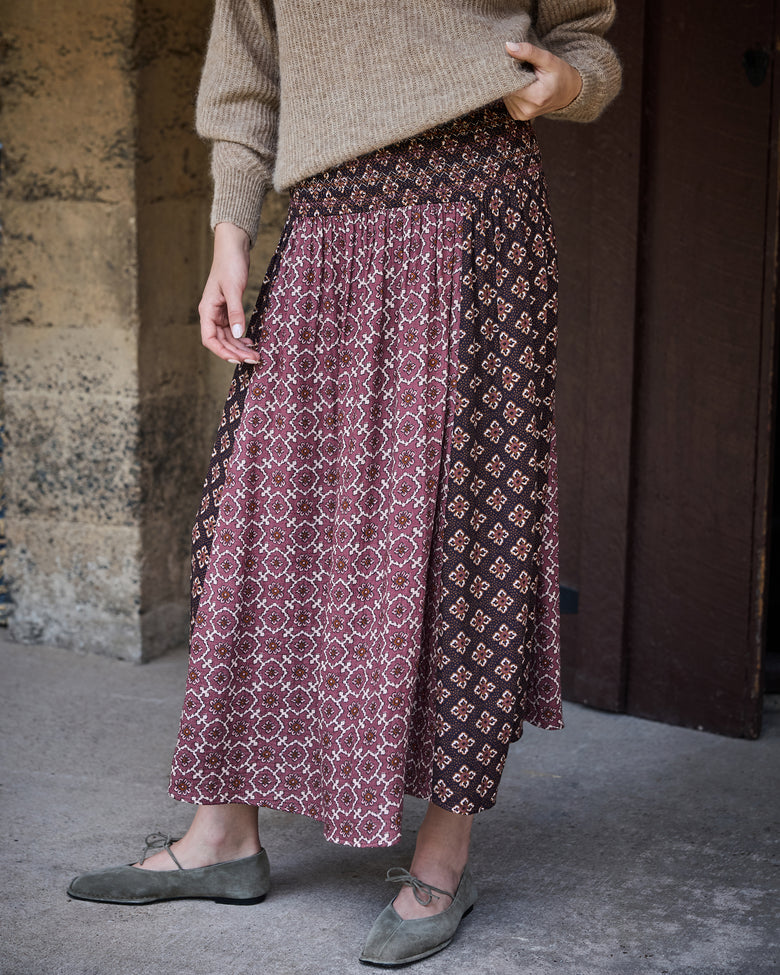 Close-up of the Coraline skirt showing its gathered waistband and contrasting patterned panels.