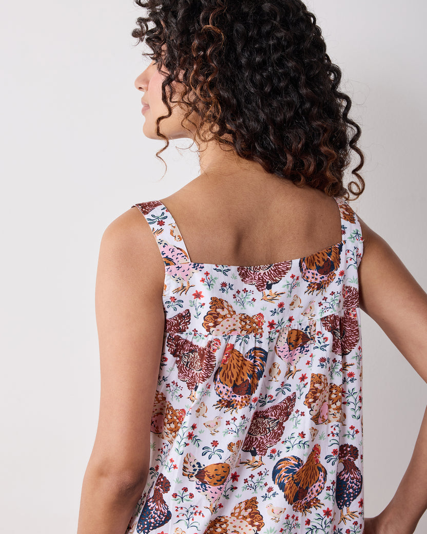 Back view of a chicken-print sleeveless nightgown with wide shoulder straps.