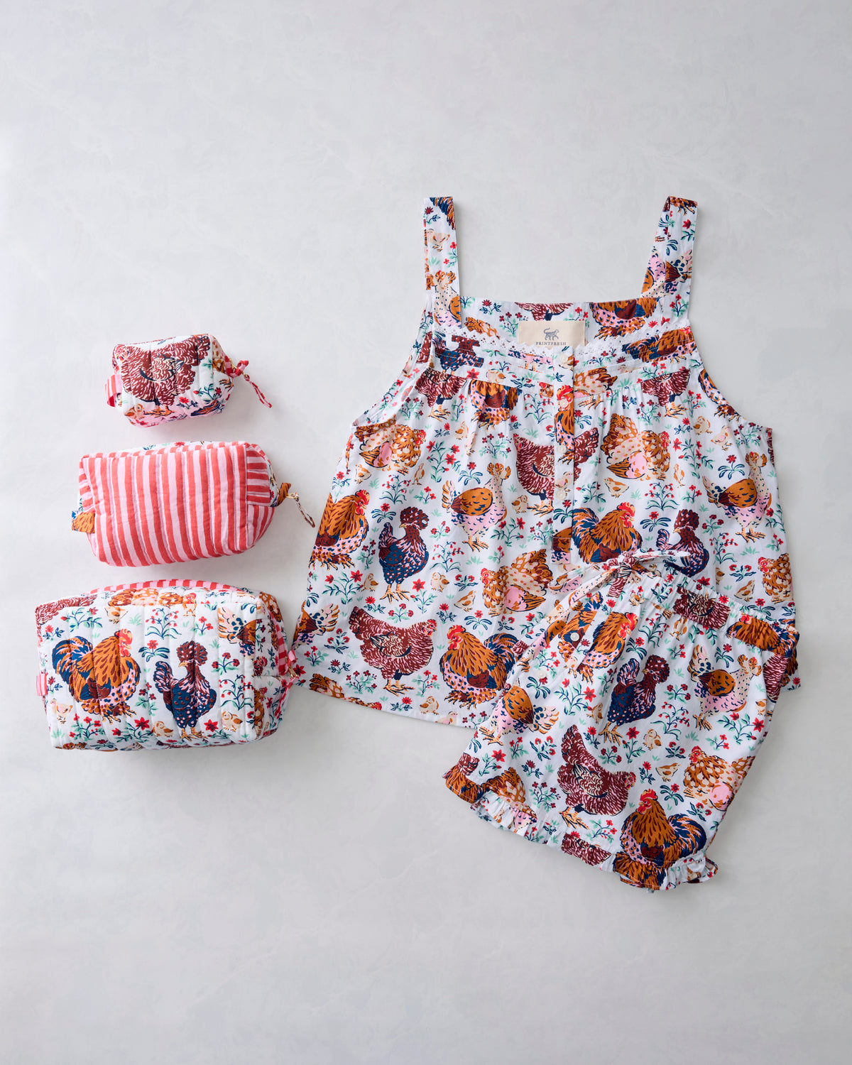 Chicken-print sleeveless pajama top and shorts with three coordinating quilted pouches.
