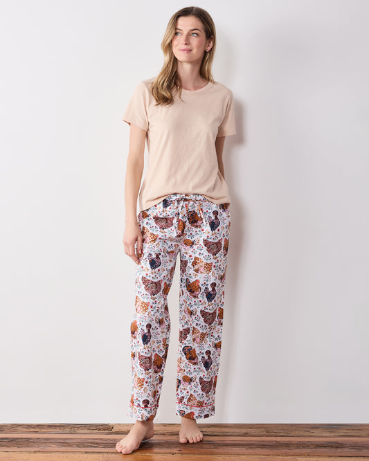 Full-length front view of printed pajama pants with a drawstring waist and straight legs.