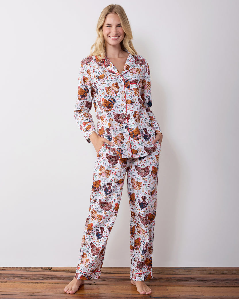 Full-length front view of a long chicken-print pajama set with a collared button-front top and side pockets.