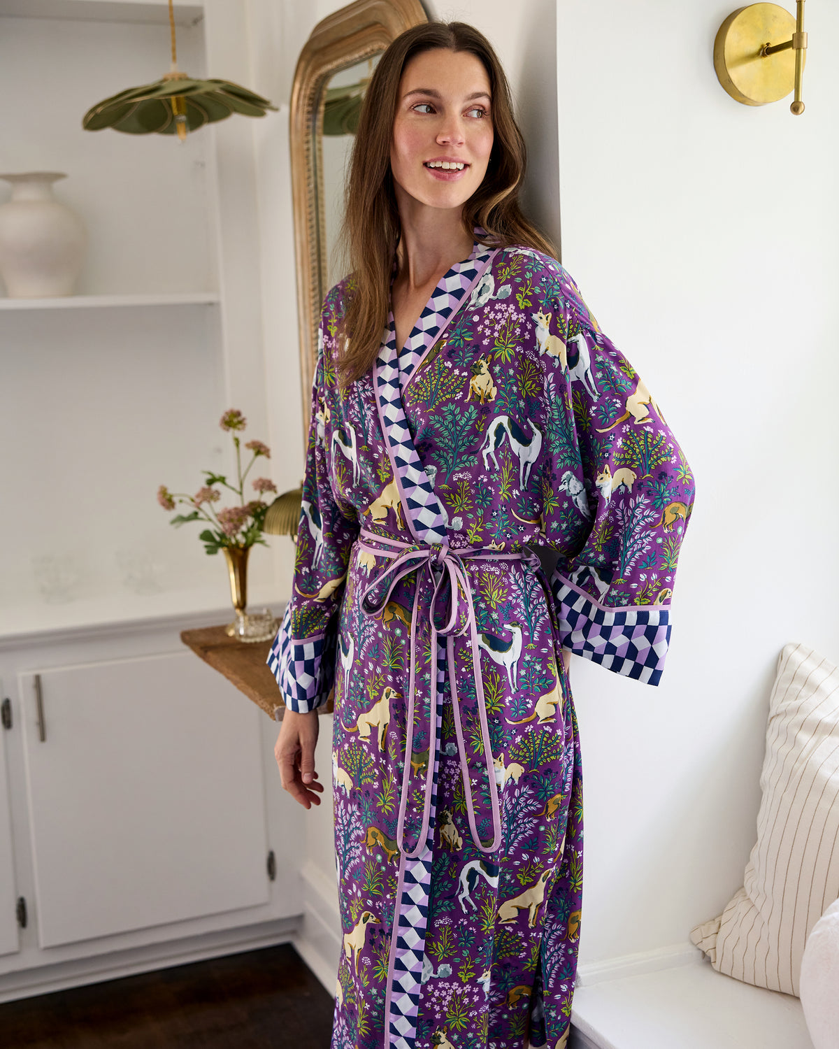 Person wearing the Amethyst Must Love Dogs satin robe with a dog-and-floral print, contrasting trim, and waist belt.