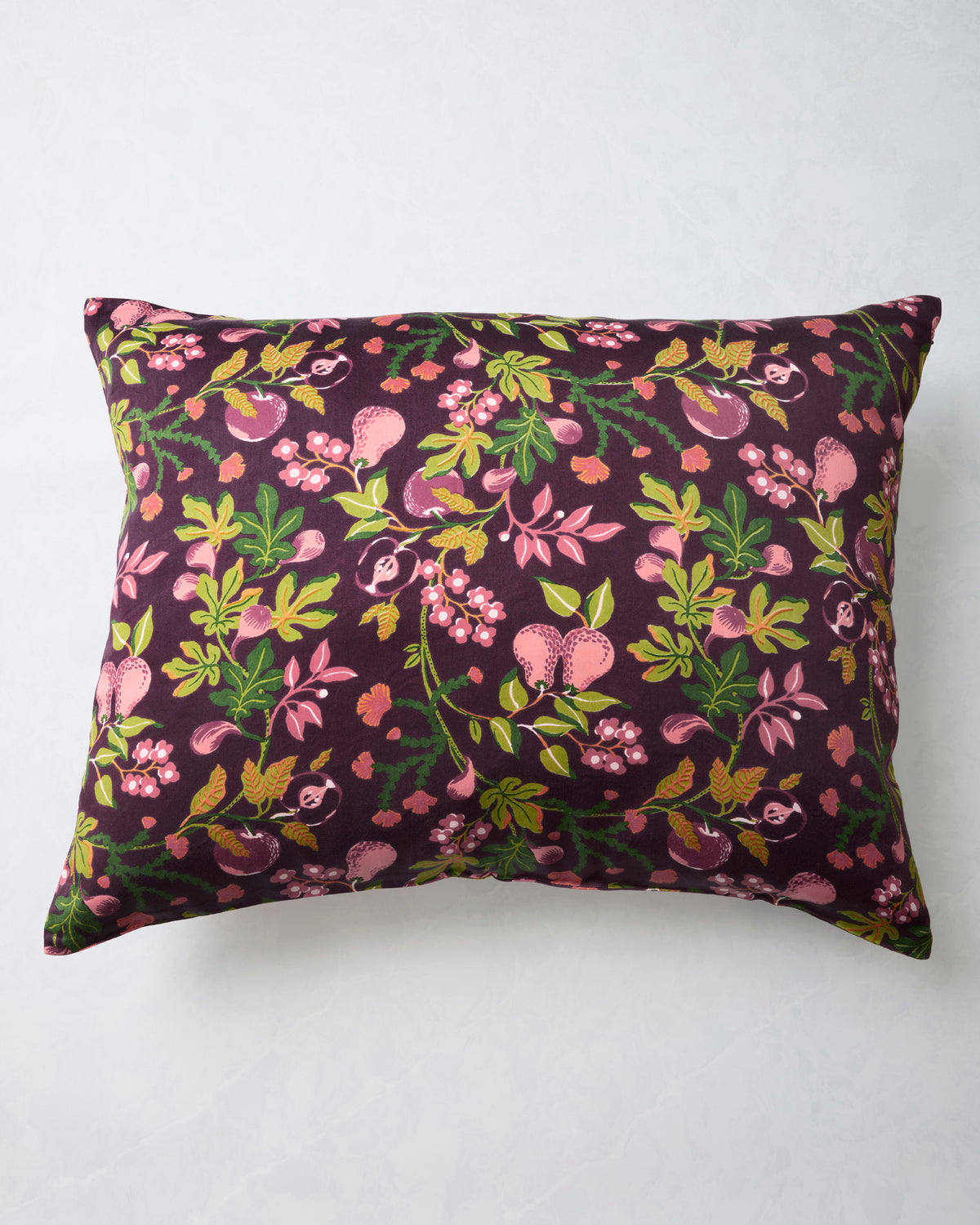 Plum Pomme & Poire pillowcase with an all-over pattern of apples, pears, flowers, and green leaves.