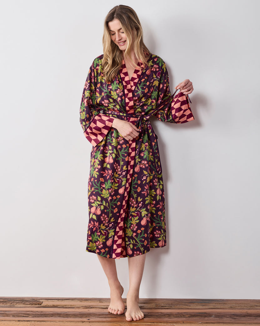 Full-length front view of the plum Pomme & Poire robe with a tied belt, long sleeves, pockets, and contrasting geometric trim.