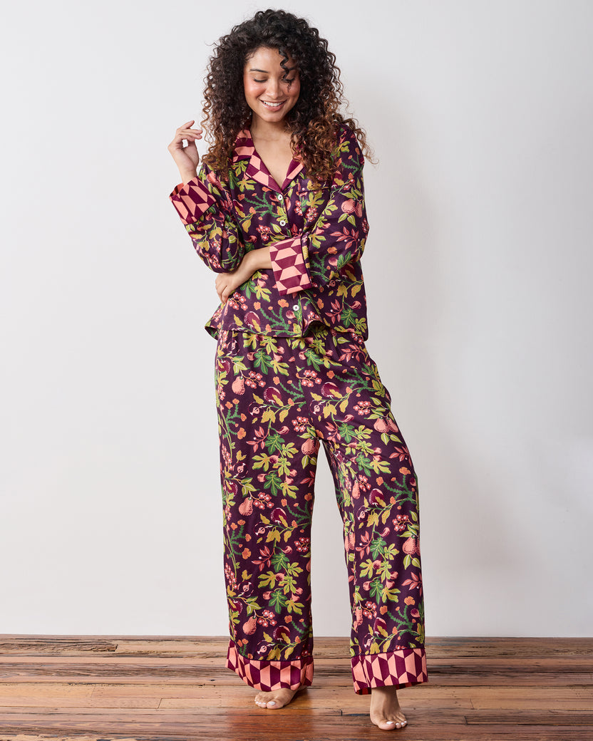 Full-length view of the plum Pomme & Poire Soho pajama set with a button-front top, long sleeves, wide-leg pants, and contrasting geometric trim.