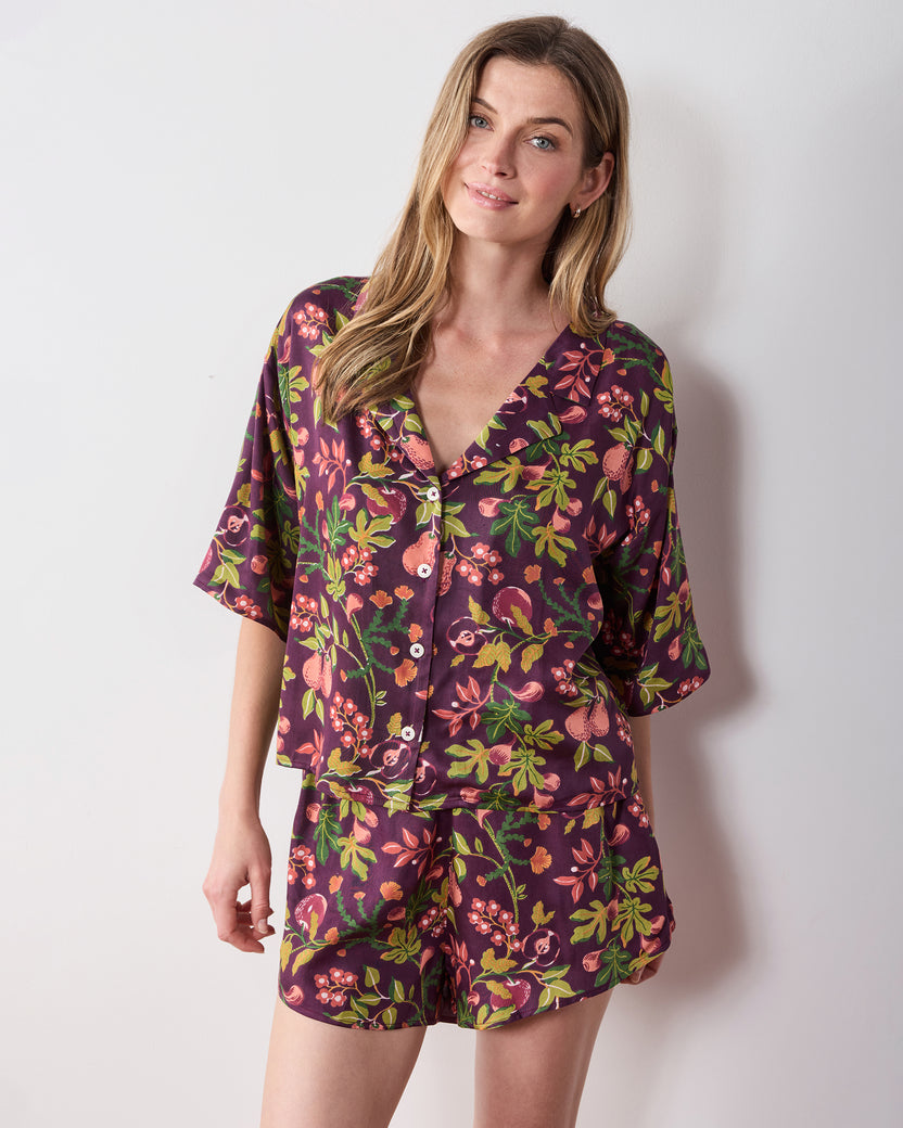 Closer front view of the plum Pomme & Poire Sweet Dreams short pajama set with a V-neck button-front top and matching shorts.