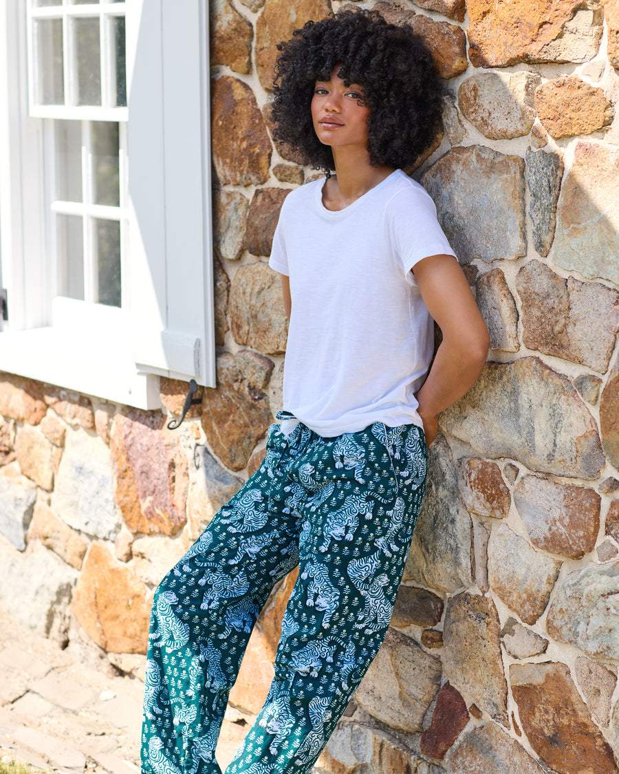 Full-length green Tiger Queen pajama pants with an all-over tiger print, shown with a white T-shirt.