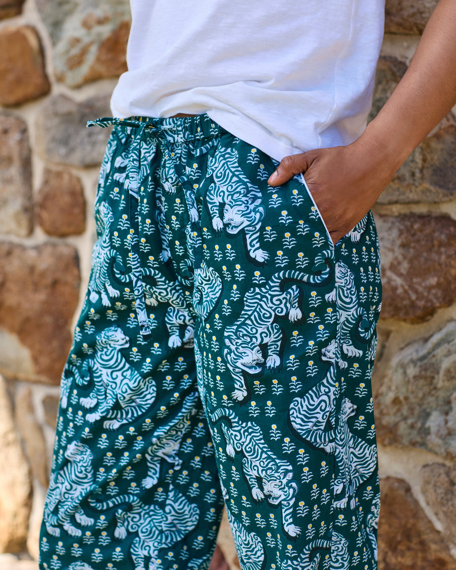 Close view of the Tiger Queen pajama pants showing the drawstring waistband, side pocket, and all-over tiger print.