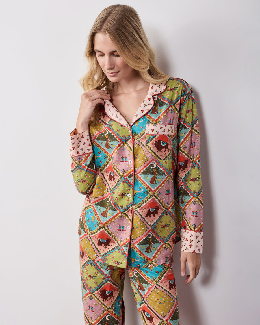 Close-up front view of the Western Scenes long pajama set, highlighting the shirt’s contrasting collar, cuffs, chest pocket, and matching patterned pants.
